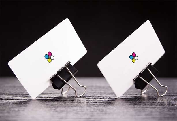 Business cards held up by bulldog clips