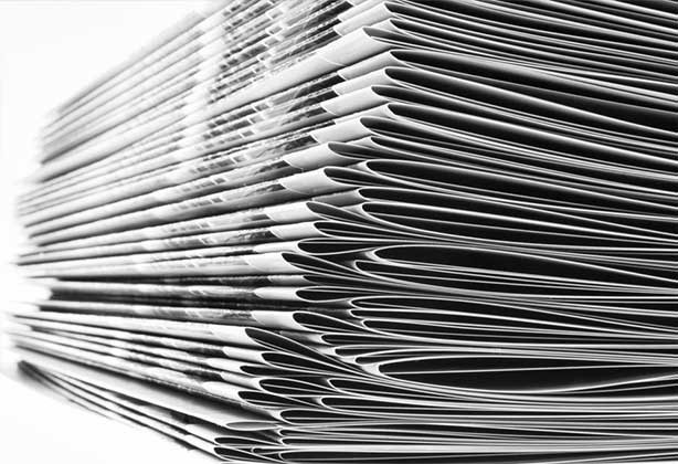 A stack of double stapled, A4 booklets